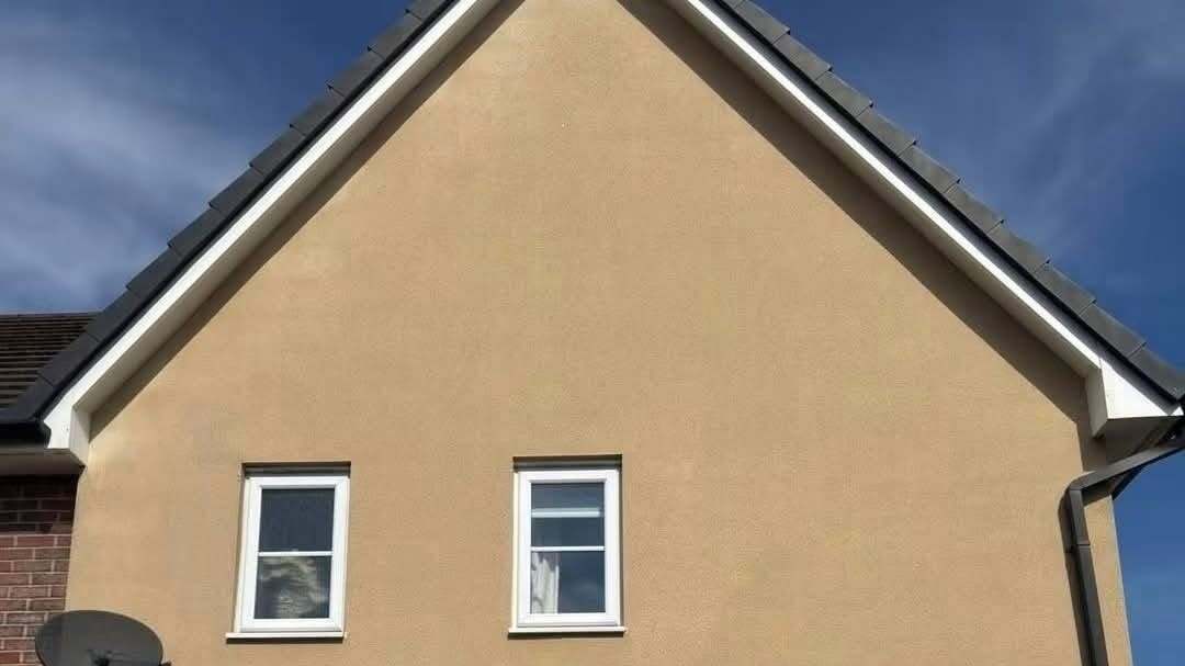 A rendered house wall after a soft wash