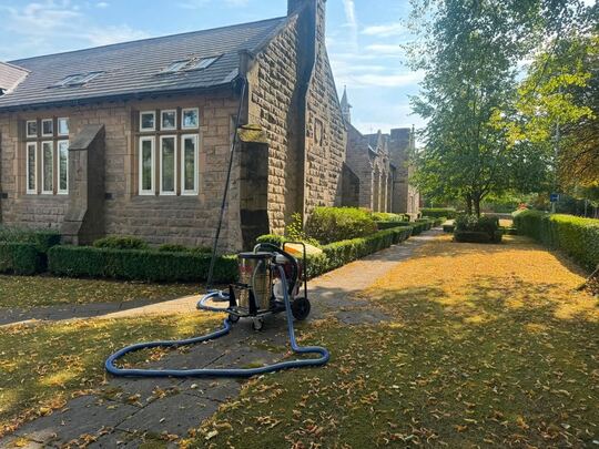 SkyVac Interceptor in the grounds of an old stone school building converted into apartments
