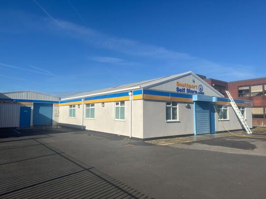 Self-storage office and storage building with clean walls and yard