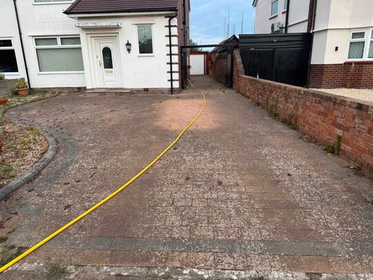 Before: block-paved driveway