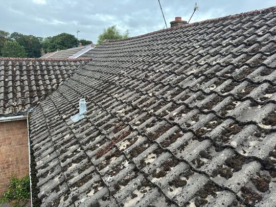 Before: concrete tile roof